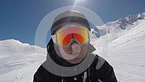 Selfie Portait Skier Accelerates Quickly Downhill Skiing In Winter Mountains