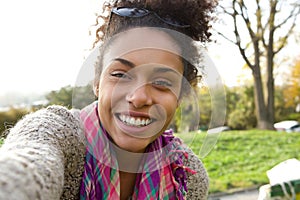 Selfie portrait of a smiling young woman