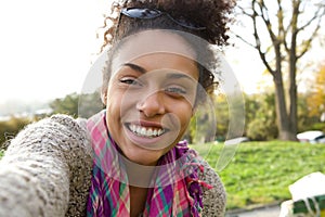 Selfie portrait of a smiling young woman photo