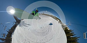 SELFIE: Pro male snowboarder catches big air while doing tricks in a halfpipe