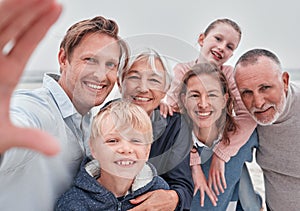 Selfie, smile and portrait of happy family on the beach for winter fun, bond and enjoy quality time together. Love