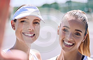 Selfie of smiling, tennis and active women looking happy after a successful sporty match outdoor in the summer sunlight