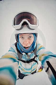 Portrait of woman on a snow-covered ski slope