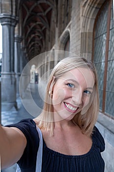 Selfie time, Attractive blonde young funky blogger is making photo for her social networks page. Young happy woman
