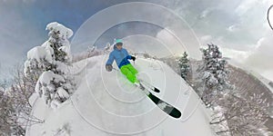 SELFIE: Young freeride skier carves down an ungroomed slope in Park City, Utah. photo