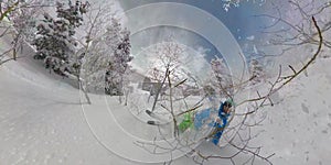 SELFIE: Young man tree skiing in Park City falls into the deep powder snow.