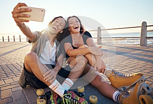 Selfie of young skater friends with phone smile and laugh at the beach. Cool cheerful man and woman smiling and having