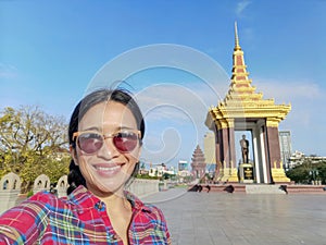 Selfie of a young woman at Norodom Sihanouk memorial, Phnom Penh, Cambodia