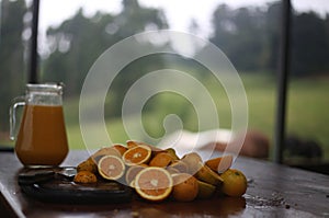 Selfmade orange juice and sliced oranges