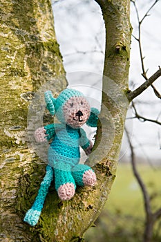 Selfmade stuffed monkey in tree