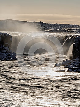 Selfoss waterfall backlit long exposure in Iceland, vertical composition