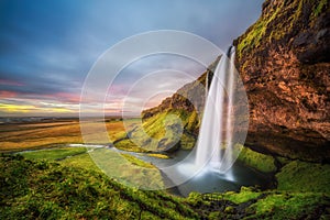 Seljalandsfoss Waterfall in Iceland at sunset photo