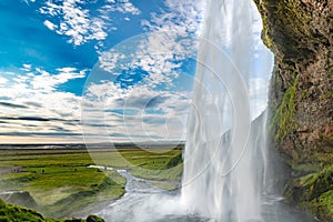 The Seljalandsfoss waterfall in south Iceland during a sunset