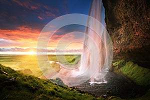 Seljalandsfoss waterfall at sunset