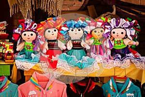 Sell of beautiful colorful mexican dolls in Xohimilco, Mexico photo