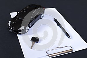 Sell, buy, rent, search for cars. Clipboard, key, pen and black car