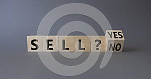 Sell Yes or No symbol. Wooden cubes with words Sell No or Sell Yes. Beautiful grey background. Business and Sell concept. Copy