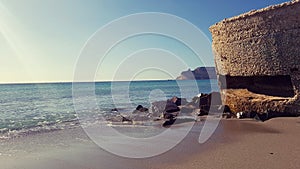 Sella del Diavolo promontory viewed by Poetto beach, Cagliari, Italy