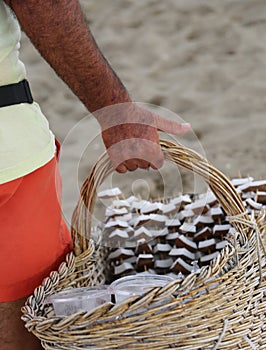 Seller of fresh coconut and fruit on the beach