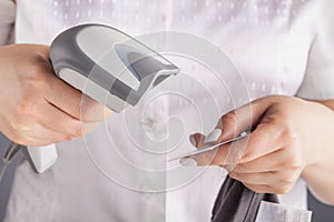 Seller holding barcode scanner in a hand