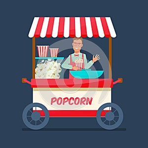 Seller of popcorn cartoon character, sells fresh popcorn behind counter.