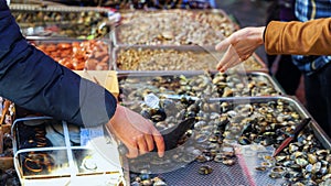 Selling Clams at a Seafood Market in Italy