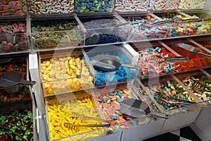 Selling colorful lollipops and sweets from a counter