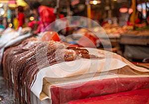 Selling fresh octopus on fish market in Busan