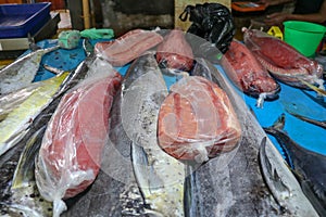 Selling fresh seafood fish on the tourist attraction local market in Jimbaran, Bali Island. Fresh fish for sale. Dorado dolphin