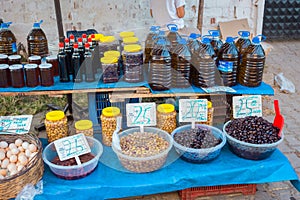 Selling Turkish olives in local market place in Turkey. Marinaded green and black olives.