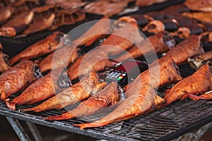 Selling various smoked fish in a street food market