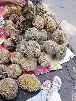 Sellings durians on the roadside