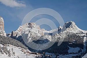Selva Val Gardena in Winter, with the Cirspitzen and Crespeina in the Background. Majestic Mountains above Wolkenstein in GrÃ¶den