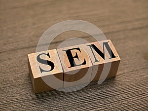 SEM Search engine marketing, text words typography written with wooden letter, life and business motivational inspirational terms