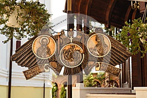 Semantron hanging at Plumbuita monastery in Bucharest, Romania. Religious carved metal bronze plate.