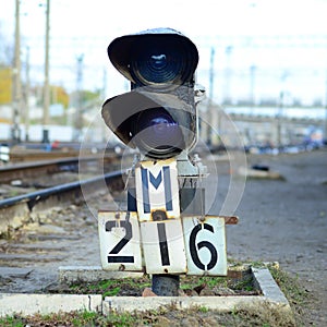 Semaphore with burning blue light. The intersection of railway tracks