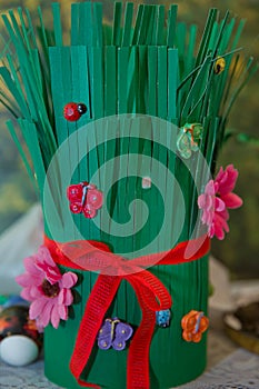 Semeni on vintage plate decorated with red cord on national style table cloth . Red ribbon connected Semeni . Green Paper made