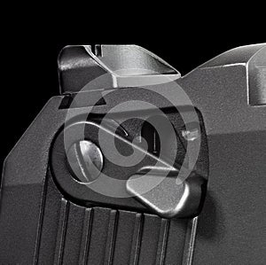 Semi-auto pistol safety and rear sight