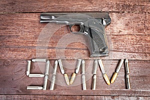Semi-automatic 9mm gun isolated on wooden background