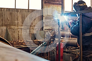 Semi-automatic welding of metal structures in the shop