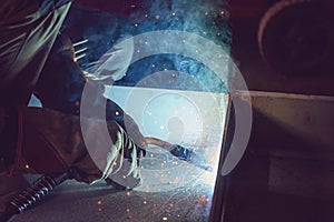 Semi-automatic welding with sparks and smoke