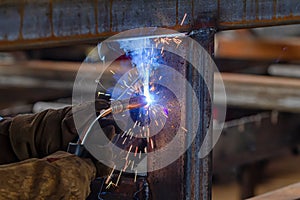 Semi-automatic welding with sparks and smoke
