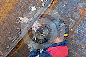 Semi-automatic welding with sparks and smoke