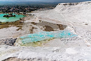 Semi-circular pools filled with azure blue water on the Tavertine Cascades at Pamukkale, Turkey