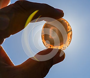 semi-precious stone agate in hands in backlight