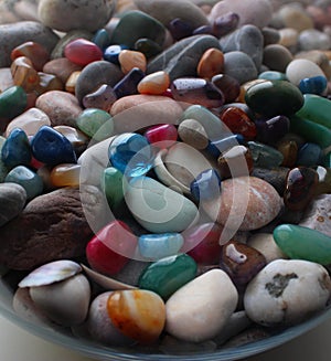 Semi-Precious Stones Mixed With Pebbles And Seashells In Glass Vase