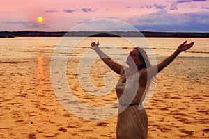 Semi Silhouette of Woman Raising Hands at Ocean