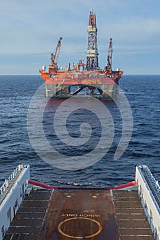 A semi-submersible drilling rig seen from the view from the bridge off an offshore vessel