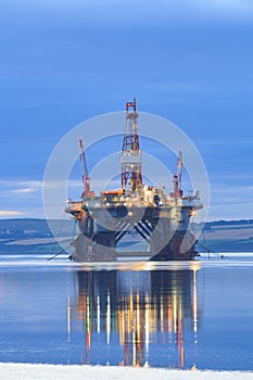 Semi Submersible Oil Rig during Sunrise at Cromarty Firth photo