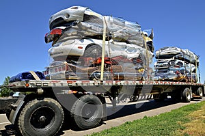 Semi trailed loaded with crushed cars.